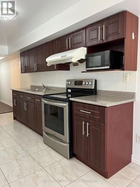 Markham (Cedarwood) apartment for rent - A kitchen with brown cabinets and a stainless steel oven.