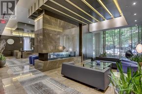 Toronto (Church-Yonge Corridor) condo for rent - A reception area with a glass counter and a brown and beige tiled floor.