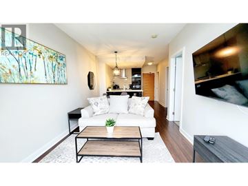 Vancouver apartment for rent - A living room with a white couch and a painting on the wall.
