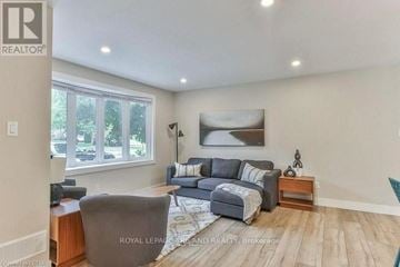 London South (South B) apartment for rent - A living room with a grey couch and a wooden side table.