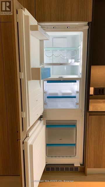 Toronto (Church-Yonge Corridor) condo for rent - A small white refrigerator with a freezer drawer is in a kitchen.
