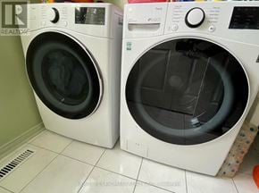 Barrie (Holly) apartment for rent - Two front load washing machines in a laundry room.