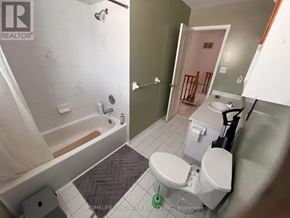 Barrie (Holly) apartment for rent - A bathroom with a toilet, sink, and shower.