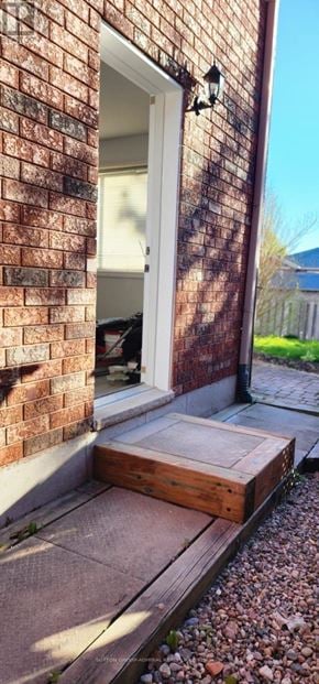 Barrie (Holly) apartment for rent - A brick house with a white door and a small porch.