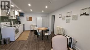 St. Catharines apartment for rent - A small kitchen with a table and chairs.