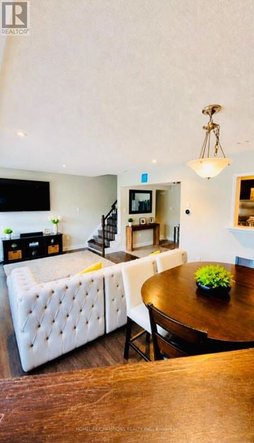 Toronto (Rouge) townhouse for rent - A living room with a white sofa and a wooden table.
