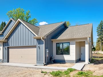 Shoreview apartment for rent - A modern house with a garage and a covered entrance.