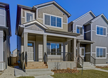 Beaumont apartment for rent - A modern house with a front porch and a small tree.
