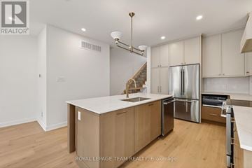 Ottawa multi-family for rent - A modern kitchen with wooden cabinets and stainless steel appliances.
