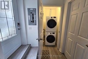 Ajax (Northwest Ajax) apartment for rent - A washer and dryer are in a small hallway.
