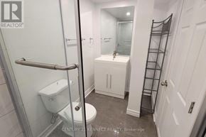 Ajax (Northwest Ajax) apartment for rent - A white bathroom with a toilet, sink, and shower.