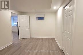 Ajax (Northwest Ajax) apartment for rent - A room with white walls and a wooden floor.