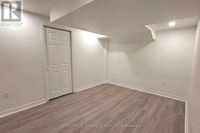 Ajax (Northwest Ajax) apartment for rent - A room with a white door and wooden flooring.