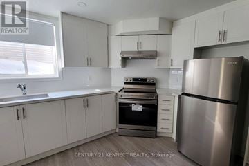 Ajax (Northwest Ajax) apartment for rent - A kitchen with white cabinets and stainless steel appliances.