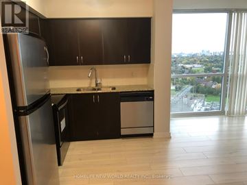 Toronto (Newtonbrook West) condo for rent - A kitchen with black cabinets and a stainless steel dishwasher and refrigerator.