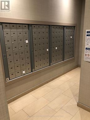 Toronto (Newtonbrook West) condo for rent - A wall of mailboxes in a hallway.