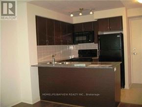 Toronto (Clanton Park) condo for rent - A kitchen with a sink and a refrigerator.
