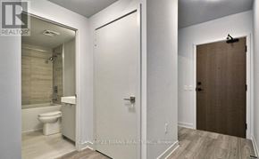 Vaughan (Concord) condo for rent - A bathroom with a toilet, sink, and shower.