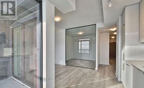 Vaughan (Concord) condo for rent - A brokerage office with a glass door and a mirror on the wall.