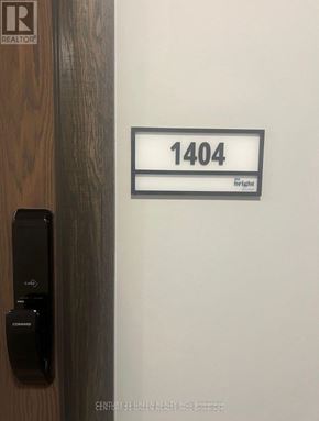 Kitchener condo for rent - Door with a sign that says 1404 on it.