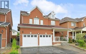 Whitby (Williamsburg) apartment for rent - A brick house with a white garage door is for sale.