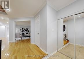 Whitby (Williamsburg) apartment for rent - A room with wooden floors and white walls, with a mirror on the right side.