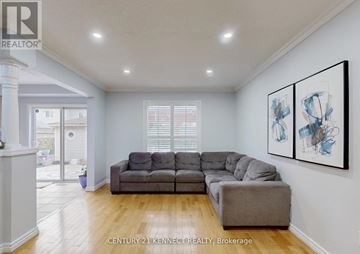 Whitby (Williamsburg) apartment for rent - A living room with a grey couch and a painting on the wall.