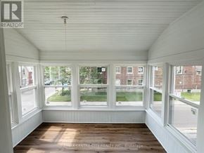St. Thomas fourplex for rent - A sunny room with a view of the street outside.