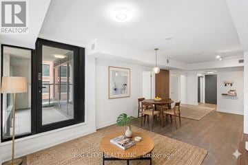 Toronto (Thorncliffe Park) condo for rent - A living room with a dining table and chairs.