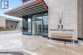 Toronto (Thorncliffe Park) condo for rent - The entrance to a building with a sign that reads "33 Frederick Todd Way".