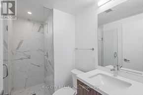 Toronto (Thorncliffe Park) condo for rent - A bathroom with a marble tile shower and white sink.