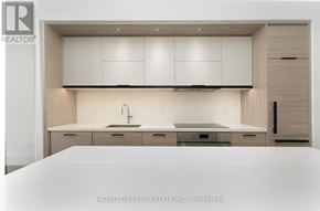 Toronto (Forest Hill South) condo for rent - A modern kitchen with white cabinets and a sink.