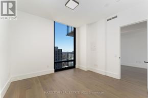 Toronto (Forest Hill South) condo for rent - A room with a view of the city through a large window.