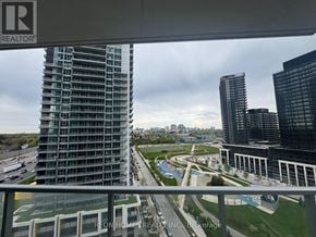 Toronto (Bayview Village) condo for rent - A view from a window of a cityscape with a Reon Homes Realty Inc. logo.