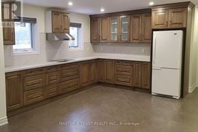 Toronto (Pleasant View) apartment for rent - A kitchen with wooden cabinets and a white refrigerator.