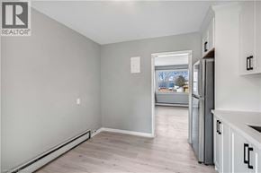Kitchener apartment for rent - A realtor's image of a kitchen and living room.