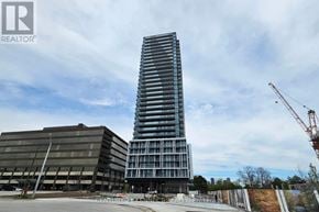 Toronto (Bayview Village) condo for rent - A tall, modern building under construction is the focal point of the image.