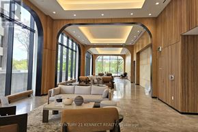 Toronto (Bayview Village) condo for rent - A modern living room with a large window and a couch.