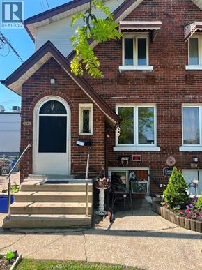 Windsor apartment for rent - A house with a realtor sign in front.