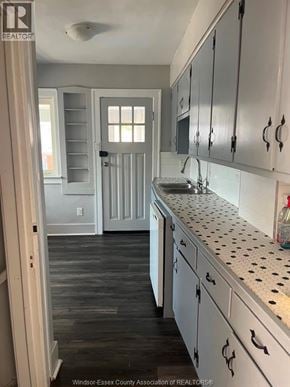 Windsor apartment for rent - A kitchen with white cabinets and a black and white counter top.