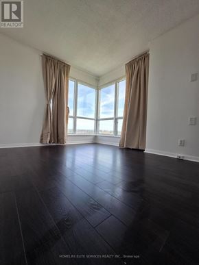 Toronto (Woburn) condo for rent - A room with a large window and curtains.