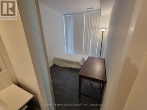 Toronto (Church-Yonge Corridor) condo for rent - A bedroom with a bed, desk, and chair.