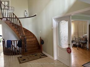 Vaughan (East Woodbridge) apartment for rent - A hallway with a staircase and a door with a stop sign on it.