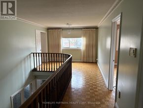 Vaughan (East Woodbridge) apartment for rent - A room with a window and a wooden floor.