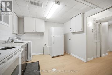 Mississauga (Clarkson) apartment for rent - A kitchen with white cabinets and appliances.