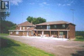 Caledon apartment for rent - A large brick house with a sign that says REALTOR in the upper left corner.