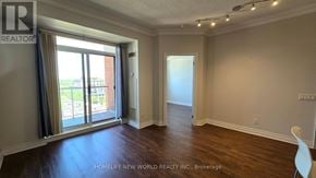 Toronto (Willowdale East) condo for rent - A room with a sliding glass door leading to a balcony.