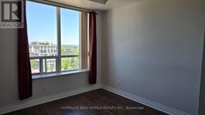 Toronto (Willowdale East) condo for rent - A room with a large window overlooking a cityscape.