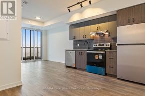 Burlington (Alton) house for rent - A modern kitchen with wooden floors and stainless steel appliances.