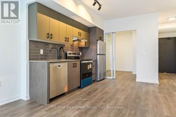 Burlington (Alton) house for rent - A modern kitchen with wooden cabinets and stainless steel appliances.